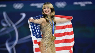 Liu captures Olympic figure skating gold as US seal hockey glory