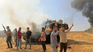 Israel says at 'war' after rare militant infiltration from Gaza