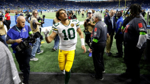 Packers' Love tames the Lions, Cowboys crush Commanders