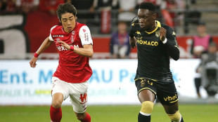 Monaco down Reims to stay top in Ligue 1
