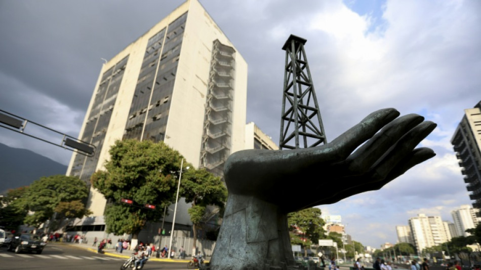 Chevron helps lift Dow to record as oil market weighs Venezuela shake-up