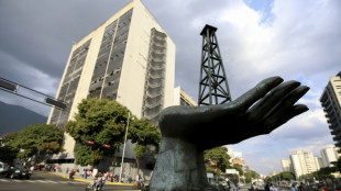 Chevron helps lift Dow to record as oil market weighs Venezuela shake-up
