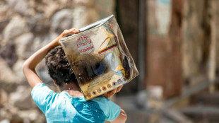 Children in war-scarred Yemen line up for water, not school
