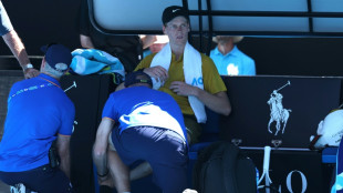 Extreme heat triggers Melbourne match suspensions as Sinner battles on
