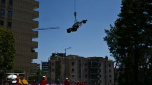 Delighted Hamilton survives crash to take sixth  