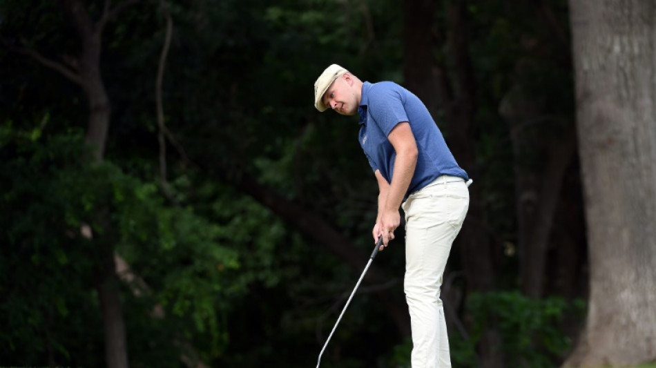 Hall leads by three at Colonial