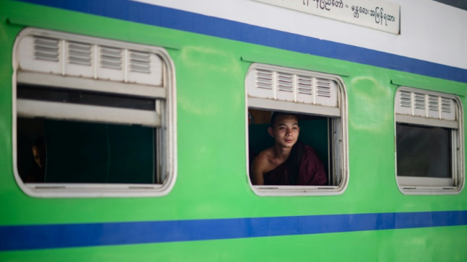  Myanmar travellers ride the rails as fuel prices rise 