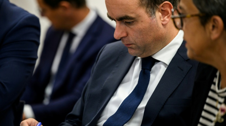  France's new PM courts the left a day after ratings downgrade 