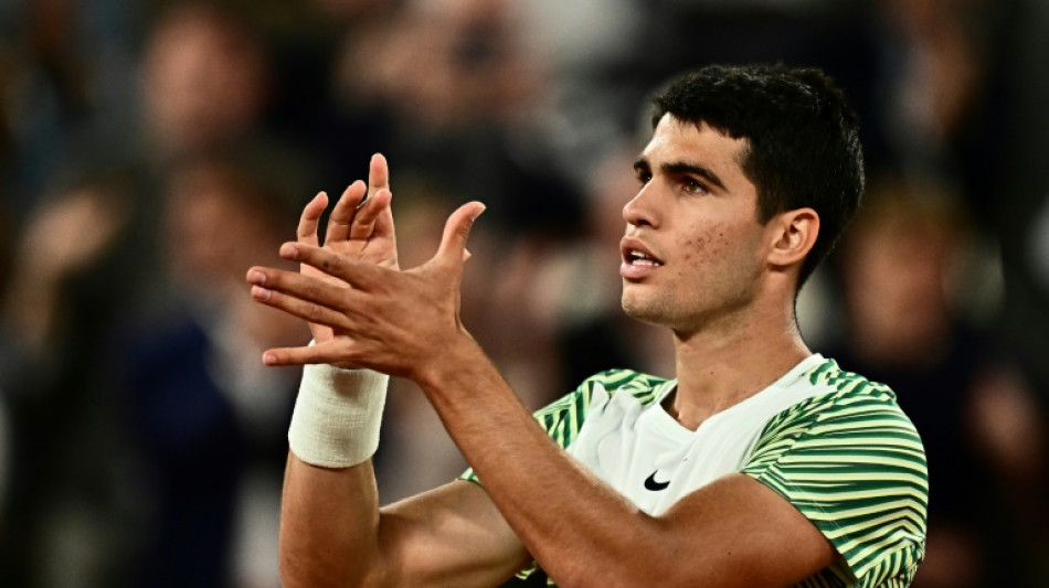 Alcaraz sets up Djokovic showdown in French Open semis