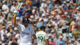 Root holds firm after Australia rock England in Ashes opener