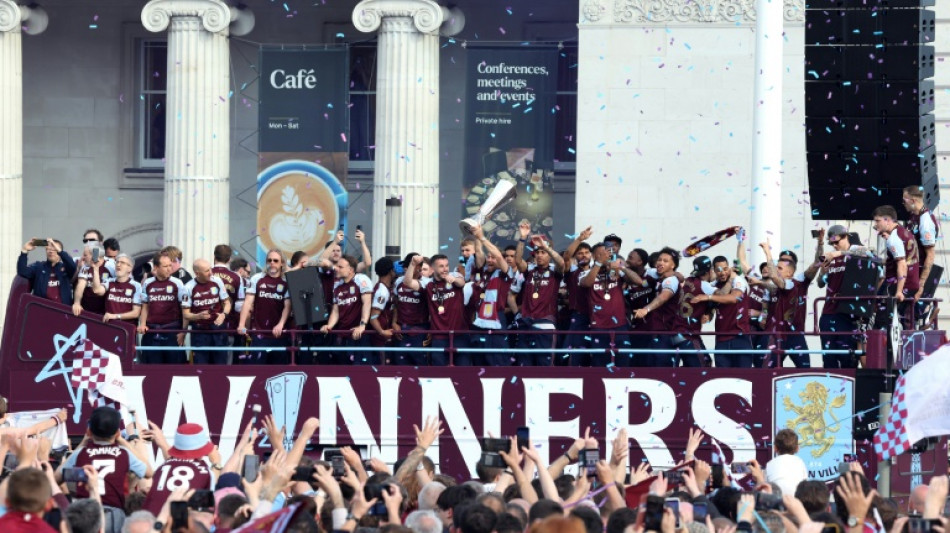  Thousands line streets to celebrate Villa's Europa triumph 