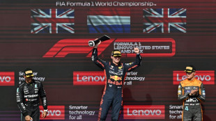 Verstappen ignores boos in battling 50th career win