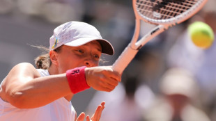 Swiatek eyes last eight as shadow of war darkens French Open mood
