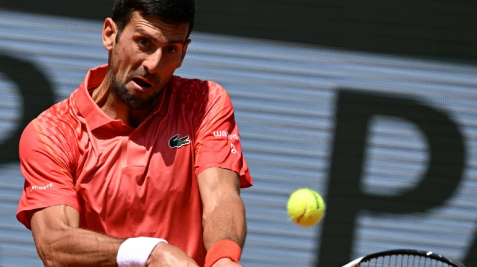 Djokovic battles into French Open second round, Alcaraz waits