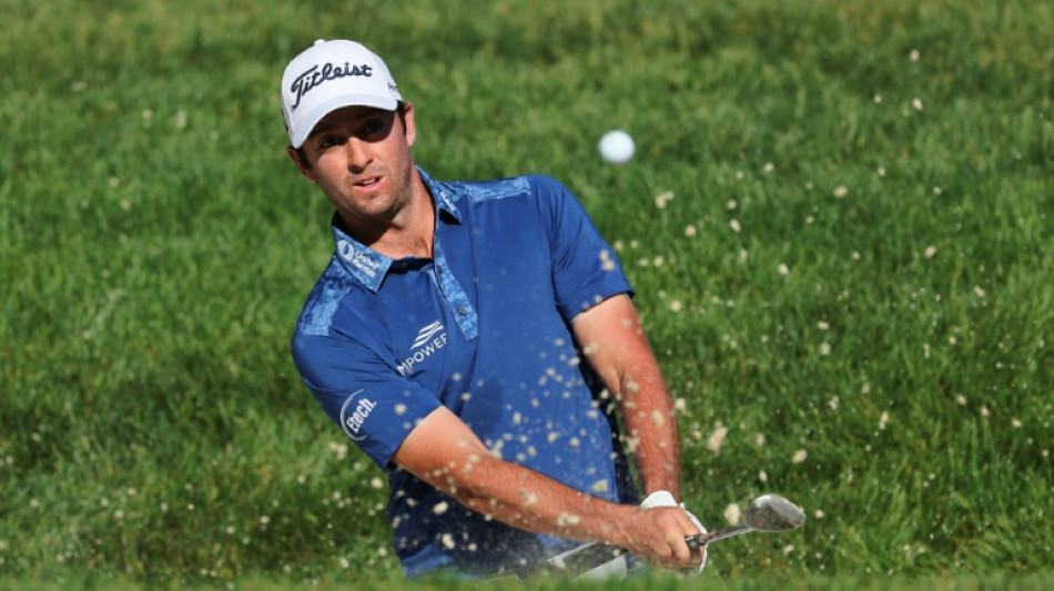 Riley leads Memorial by one after late birdie spree