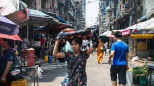 With motorbikes banned, Yangon delivery riders struggle in heatwave