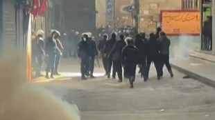 Iran security forces use tear gas in Tehran bazaar as toll rises